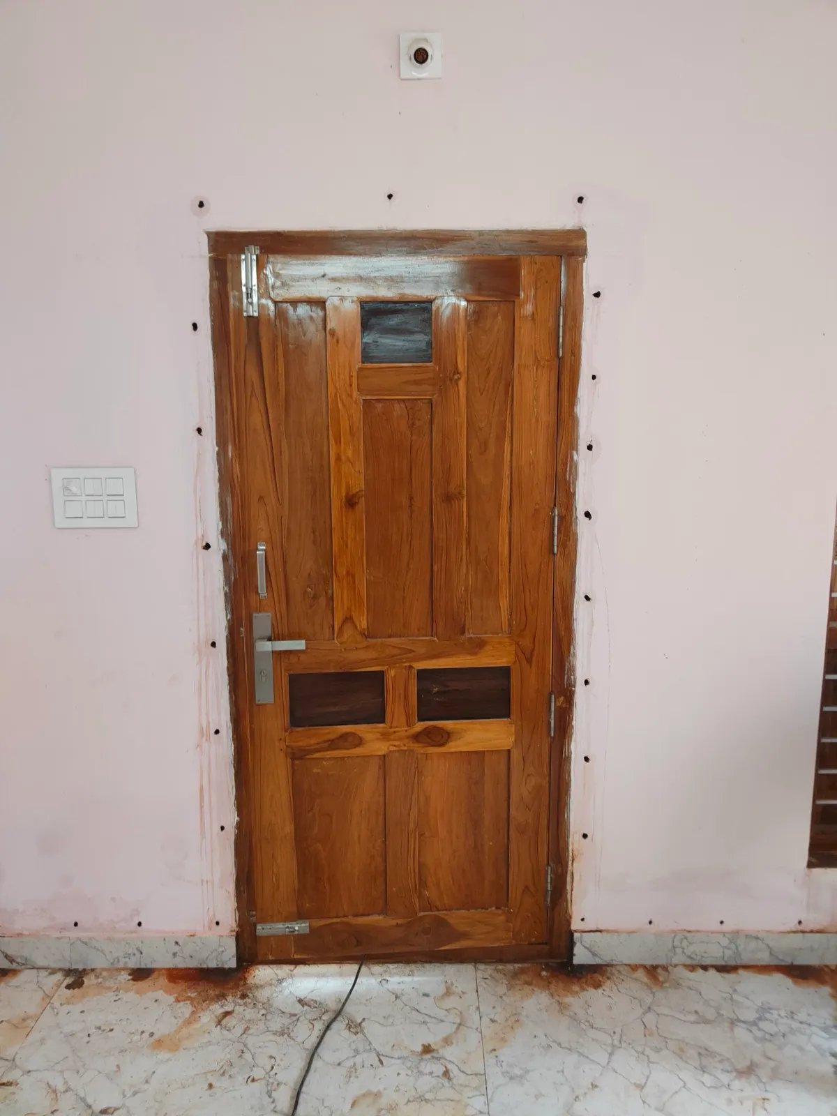 A door frame in a customer's home, drilled and treated against termites